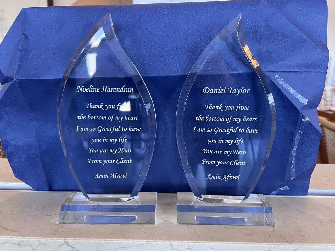 Two trophies side by side have messages on them: "Thank you from the bottom of my heart. I am so Greatful to have you in my life. You are my Hero." 
