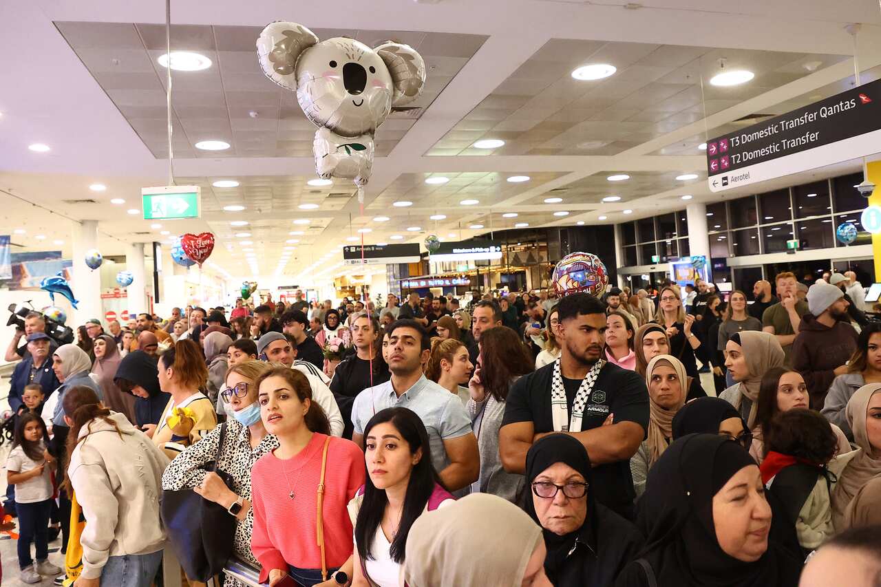 A large group of people in an airport