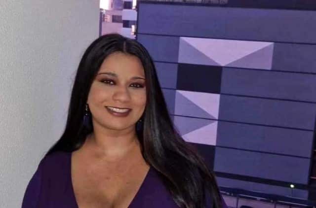 A young woman smiling at the camera