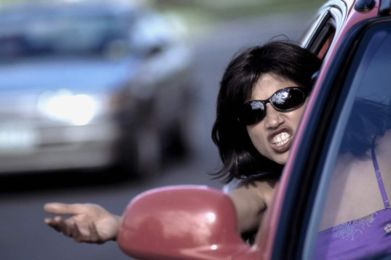Angry Woman Gestures in Car