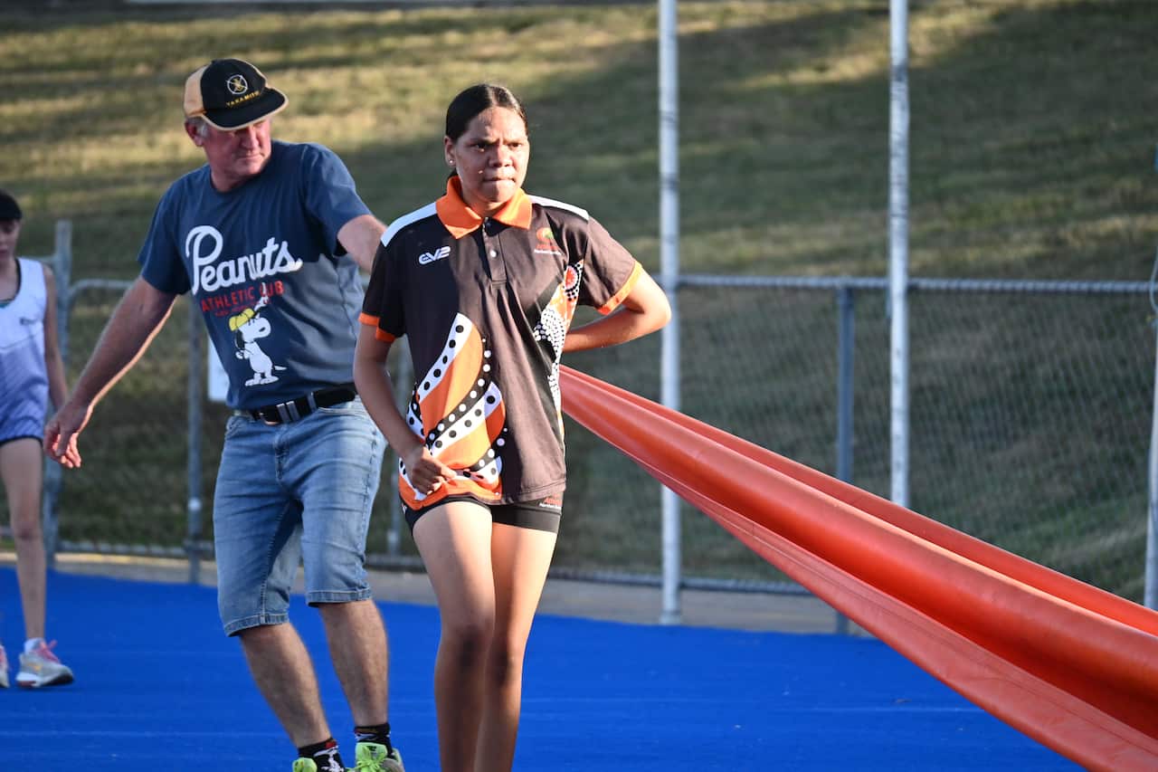 A young woman on a running track
