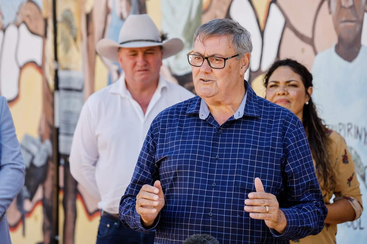 A man in a blue shirt