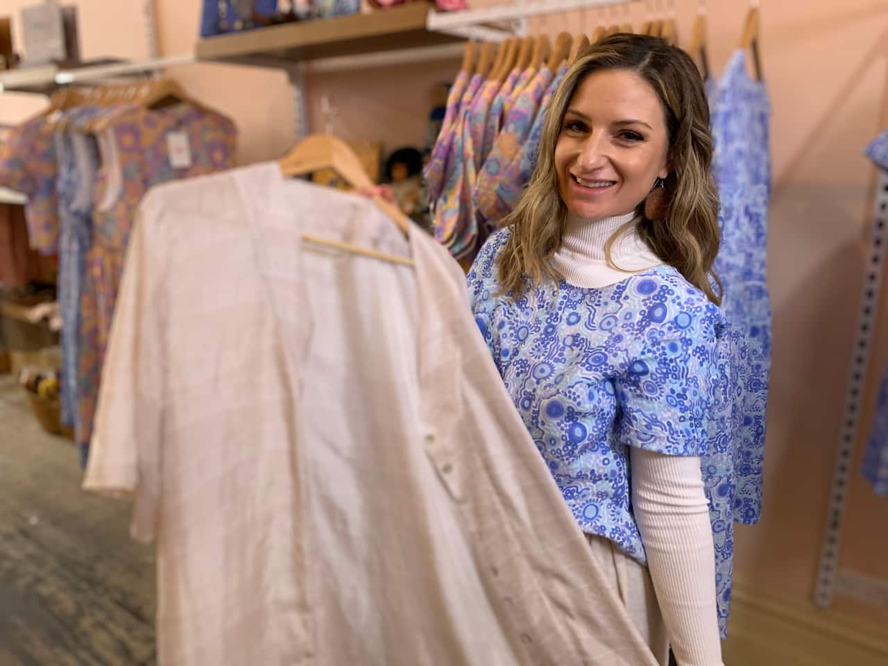 Corina Muir with one of her designs at the North Melbourne popup