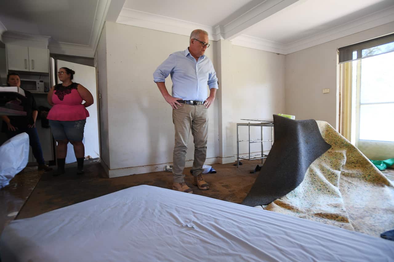 Prime Minister Scott Morrison and his wife Jenny visit the flood affected property of Darren Vaughan and Chloe Konispoliatis on Old Hawkesbury Road at
McGraths Hill in Sydney, Saturday, March 12, 2022.