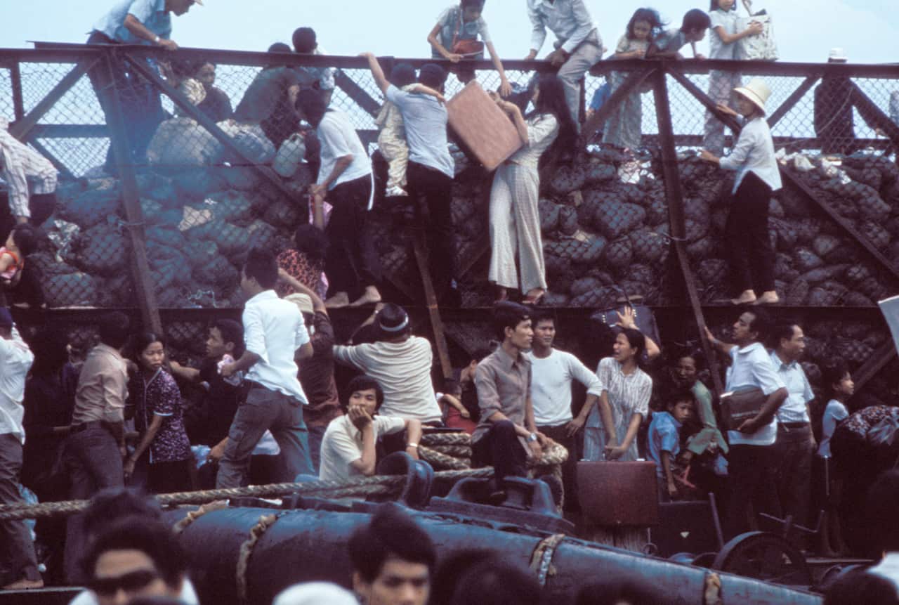 South Vietnamese board barges at Saigon Port, Fall of Saigon, Vietnam