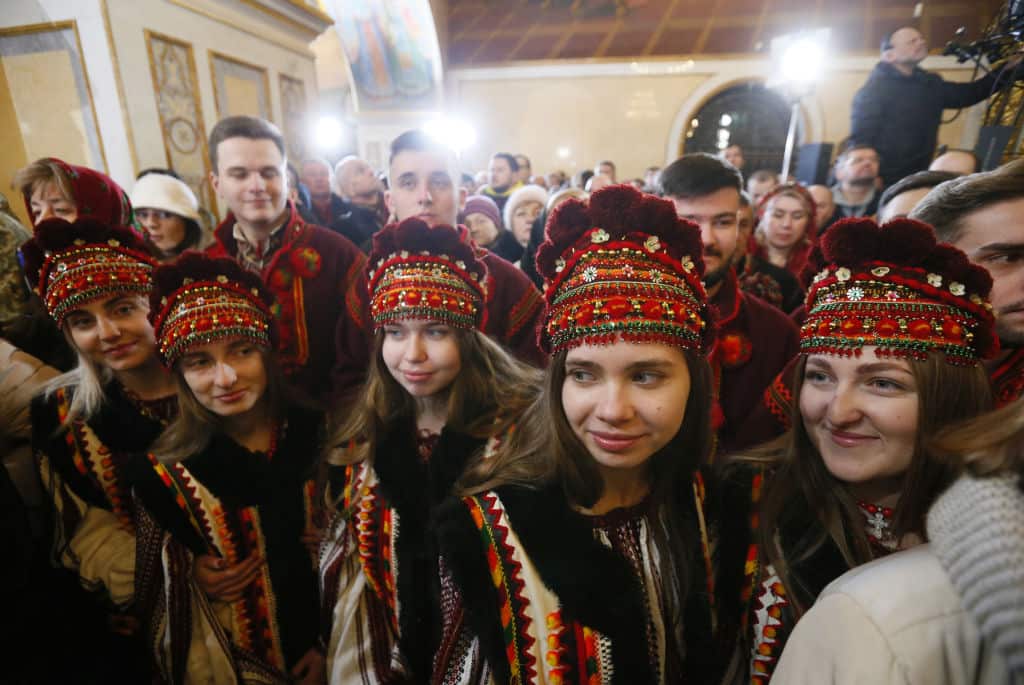 Ukrainian believers attend a Christmas service in the Holy Dormition Cathedral of the Kyiv Pechersk Lavra monastery in Kyiv, Ukraine.