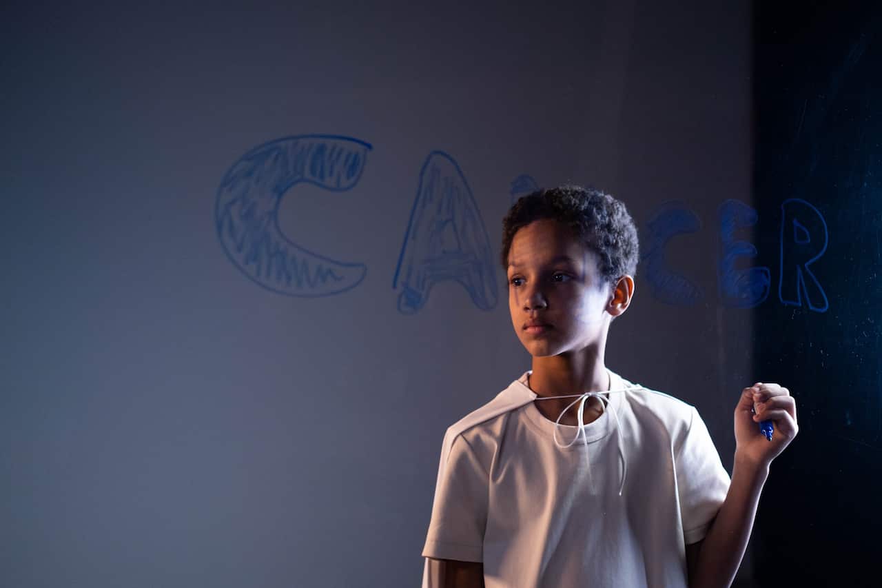 photo-cancer-Boy in white shirt writing cancer-pexels-cottonbro-studio - Copy.jpg