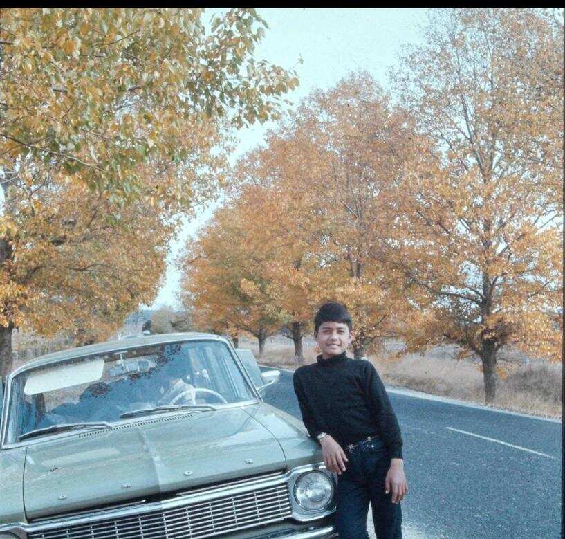 Danny Esguerra next to their car.jpg