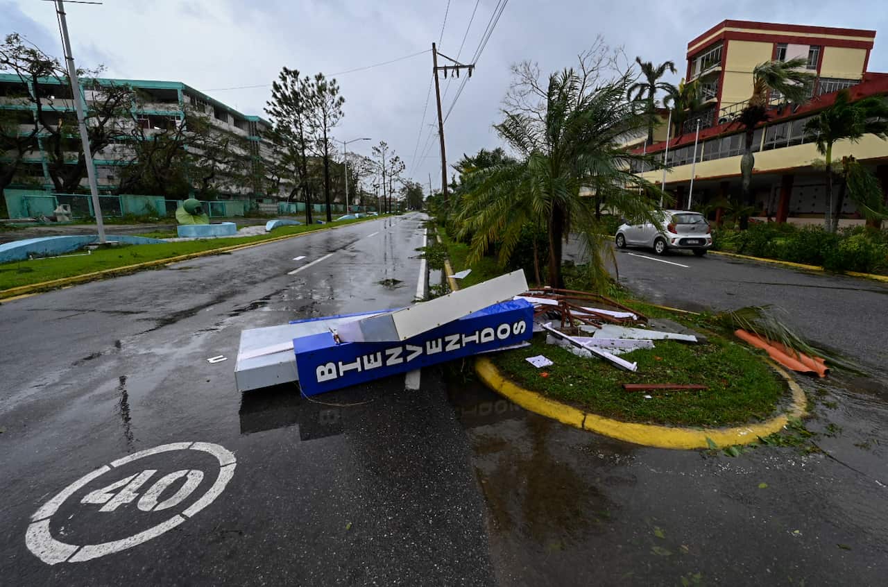 A sign toppled in a street