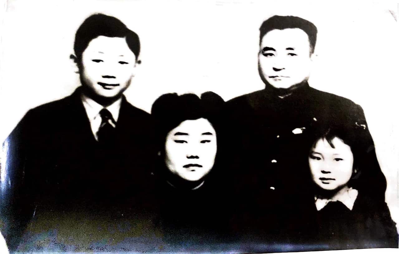 Lin with her father, mother and brother.jpg