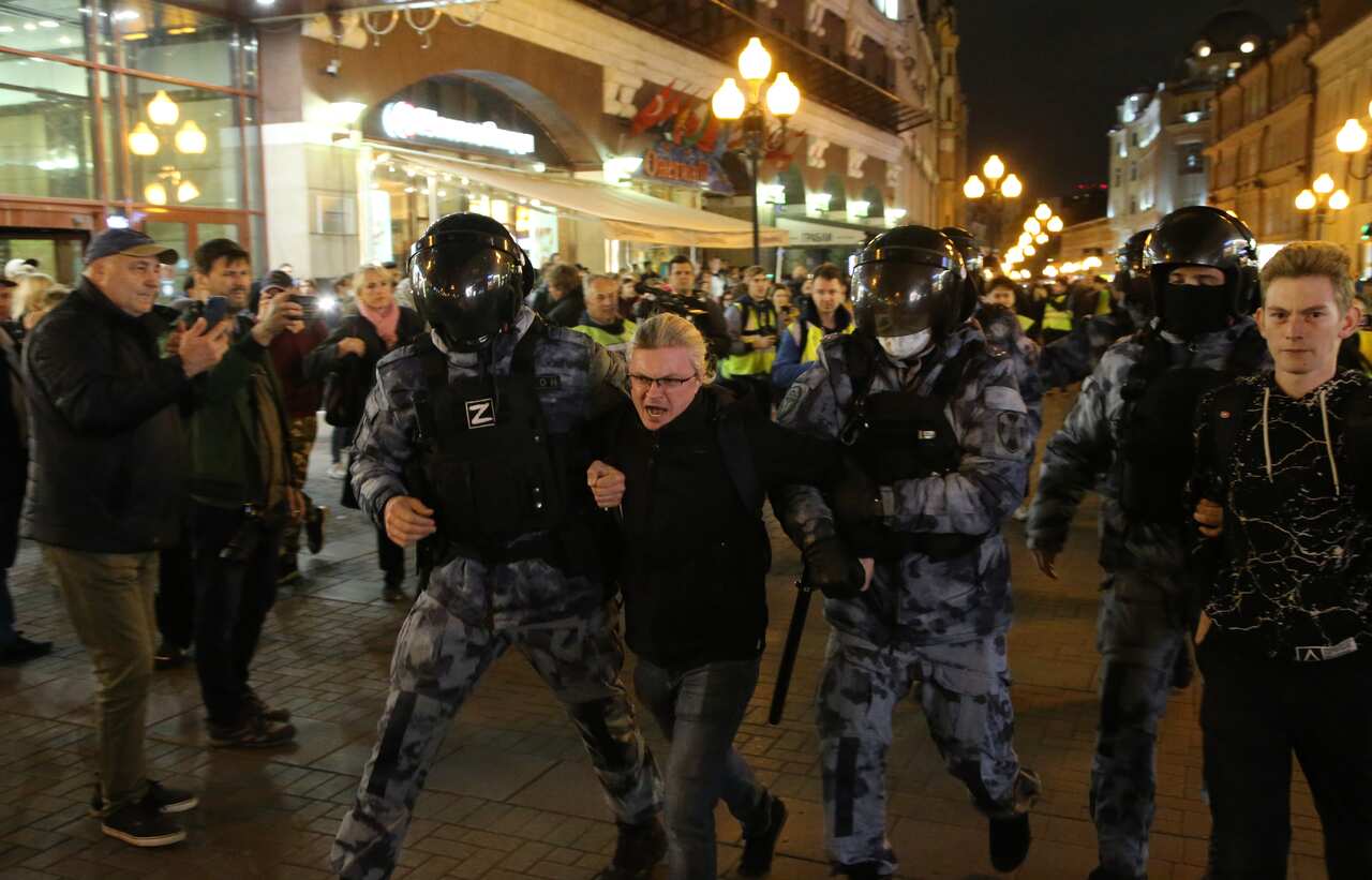 Russian police officers, one of them with letter "Z" on his uniform, a symbol of support of the military invasion in Ukraine, detain a protester during an unsanctioned anti-war protest rally  on 21 September 2022, in Moscow, Russia.