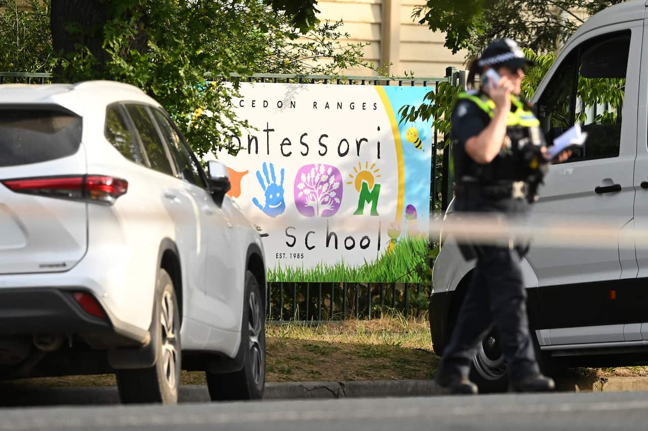 A police officer standing at a the scene of an accident