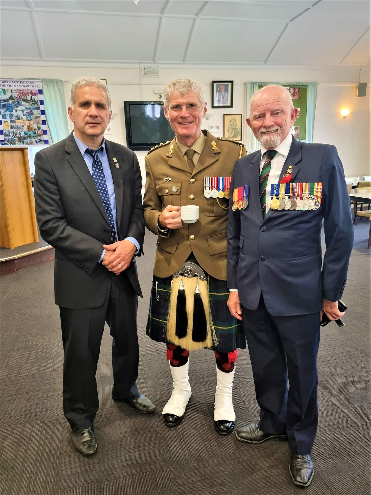 Manny Karvelas (L) with RSL members.  