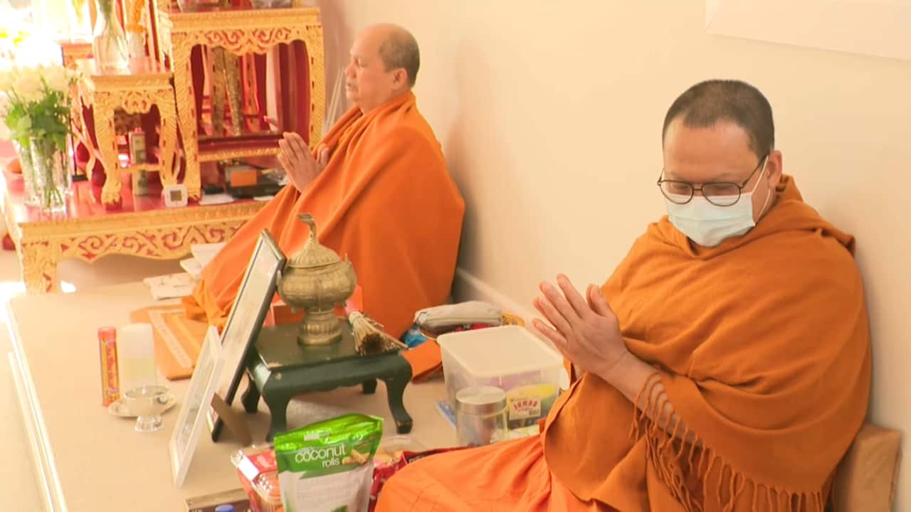 Bhuddist monks pray at the Thai Buddhist Temple in Box Hill, Melbourne.