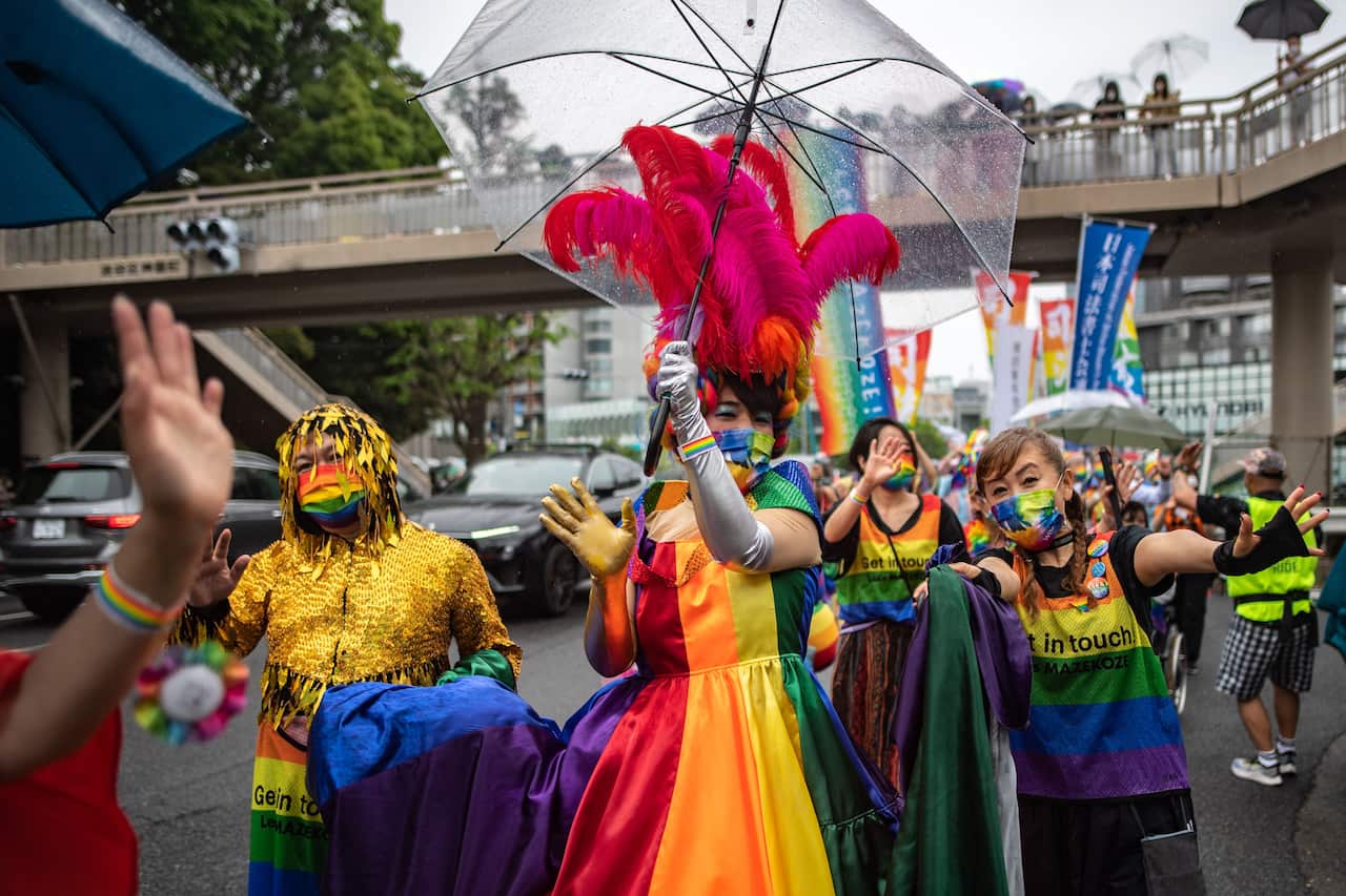 People take part in a colourful parade