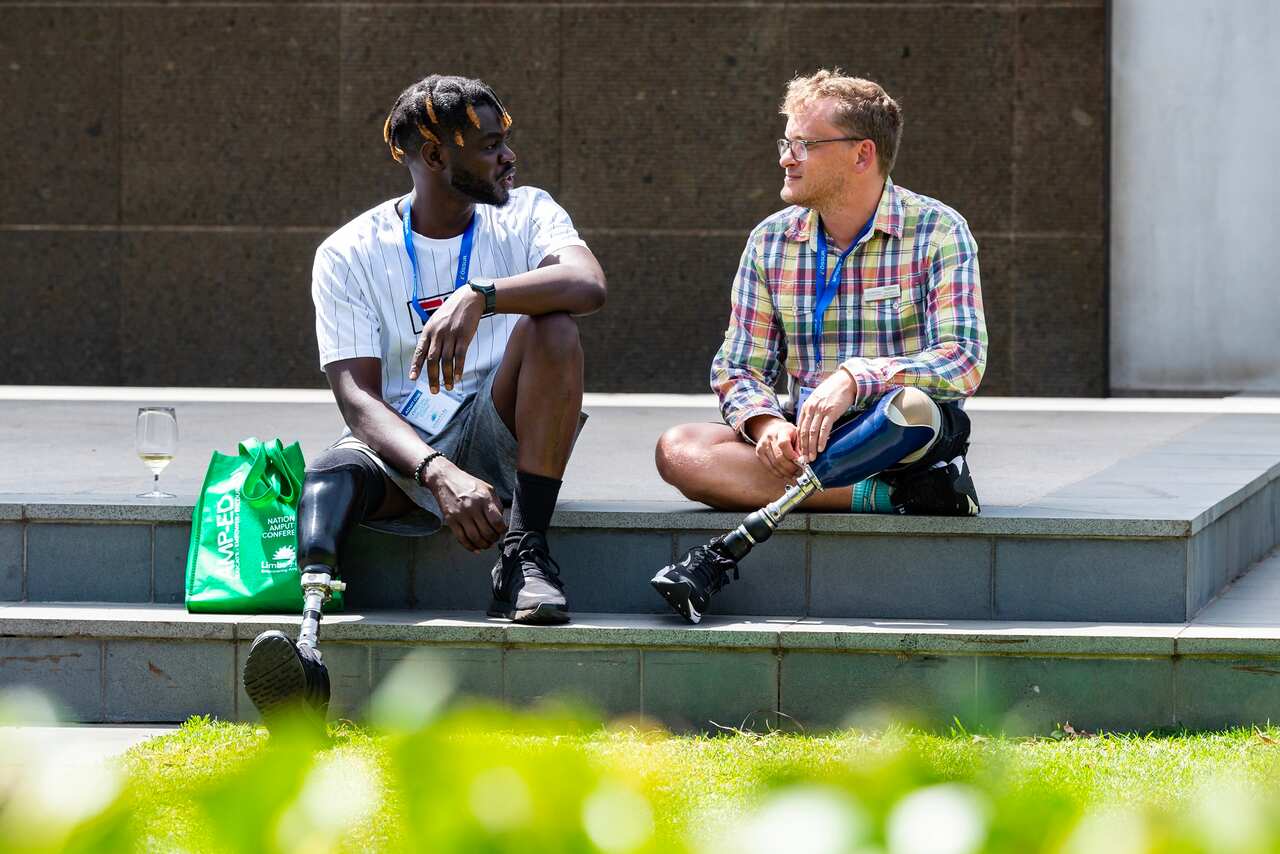 Two amputees chatting (Supplied).jpg