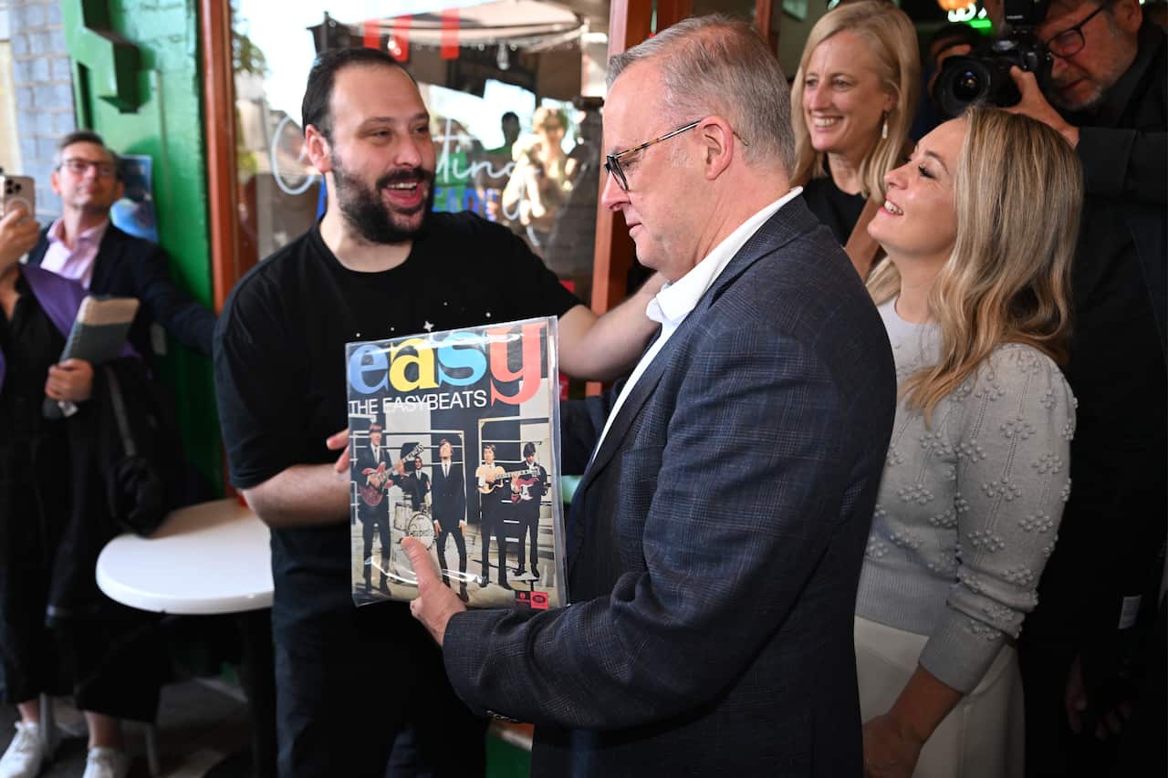 A man being given a record album.
