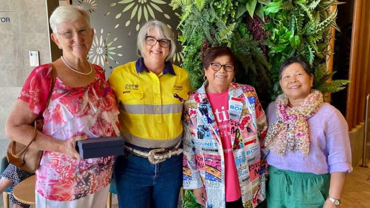 ERLINDA WITH THE WOMEN IN THE COMMUNITY.PNG