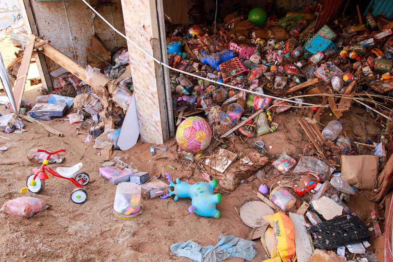 Toys are seen in a flash flood damaged shop