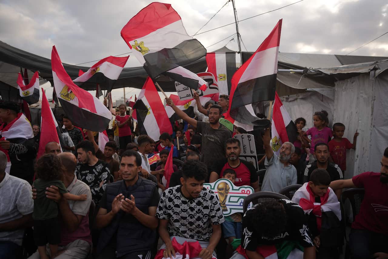 Palestinians wave the Egyptian flag in Gaza