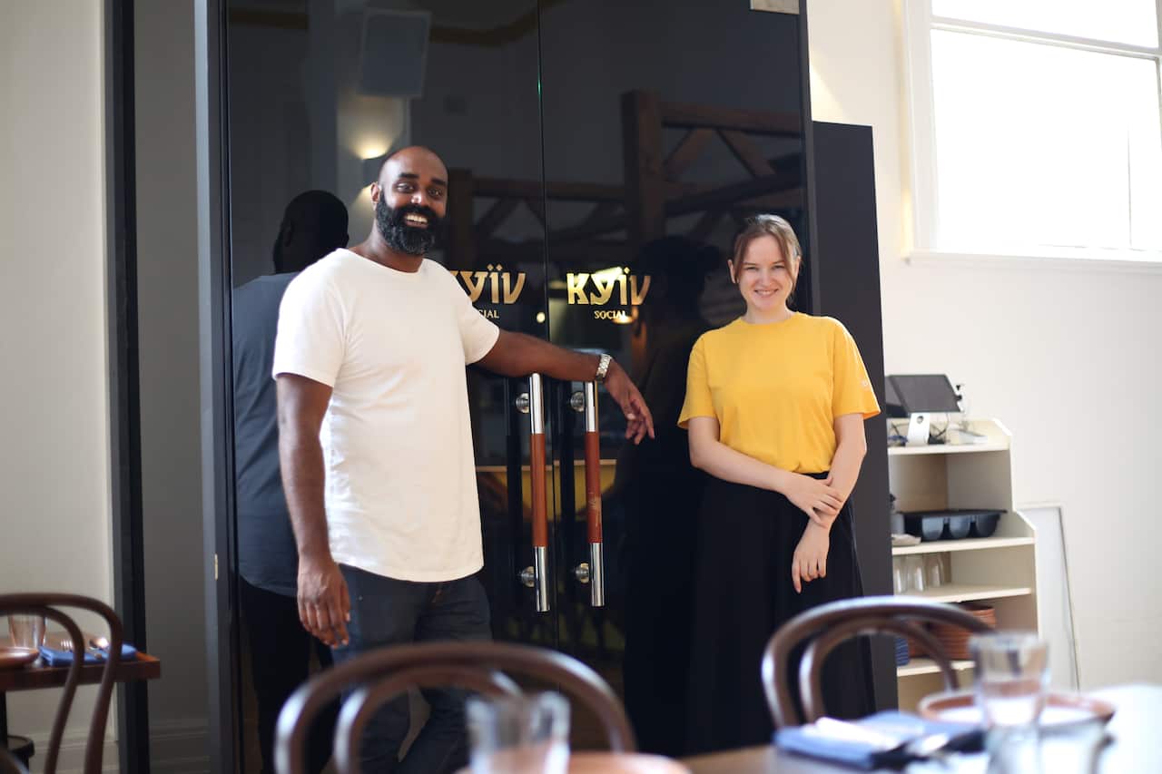 CEO of Plate It Forward, Shaun Christie-David and Iryna Humenna welcome diners to Kyïv Social.