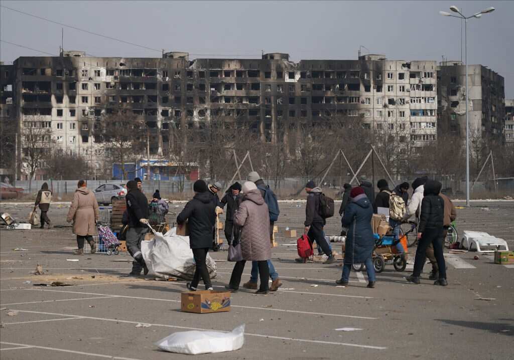 Damaged buildings are seen as civilians are being evacuated along humanitarian corridors from the Ukrainian city of Mariupol under the control of Russian military and pro-Russian separatists.