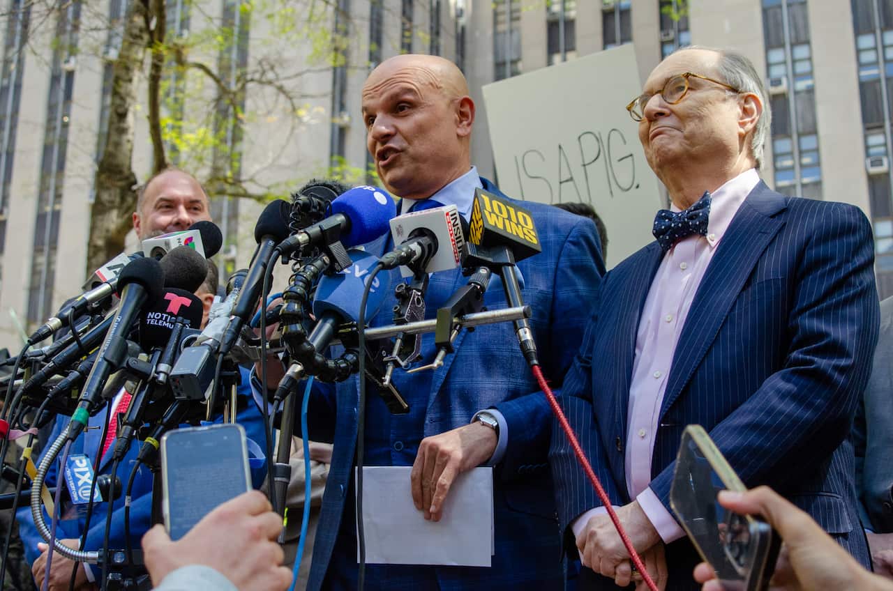 People attend a press conference.