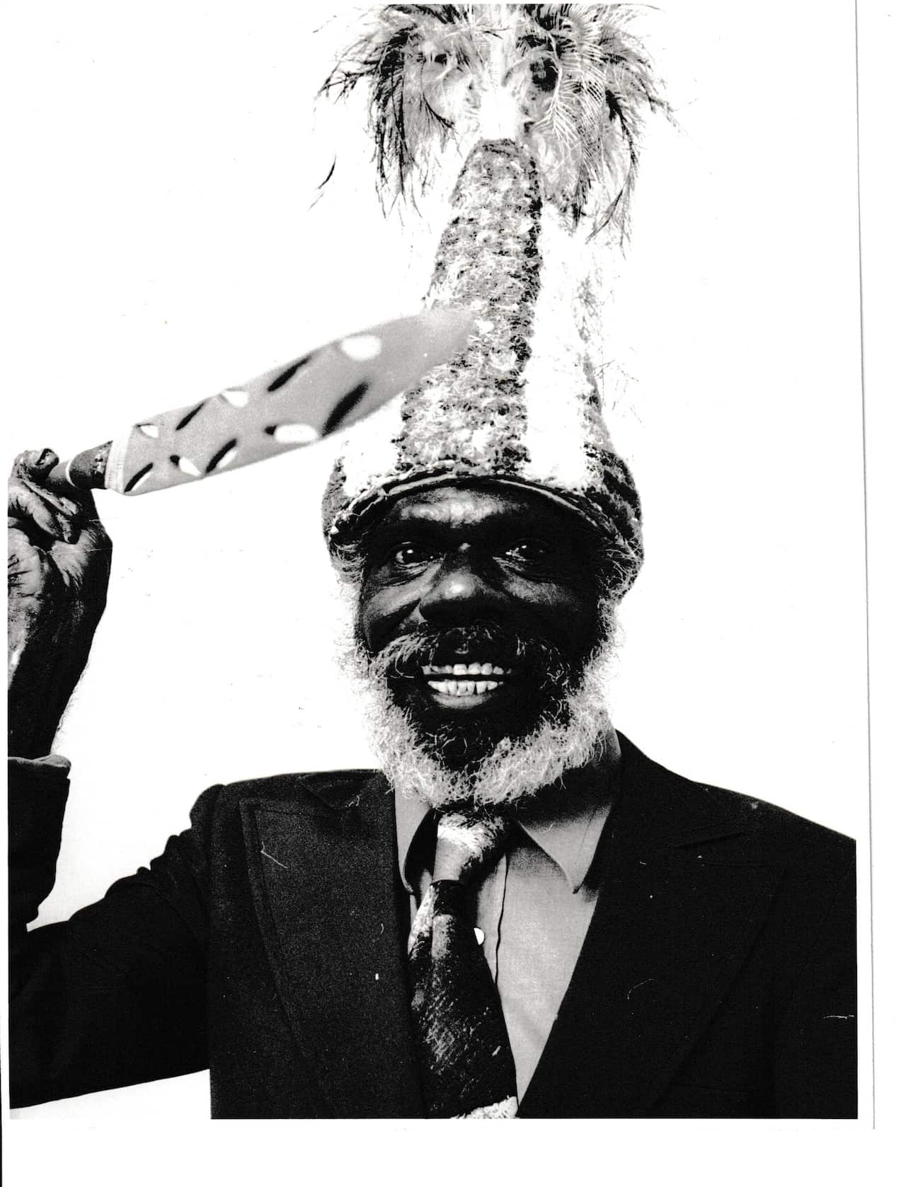 A historic black and white photo of Mr Jack wearing his headdress.