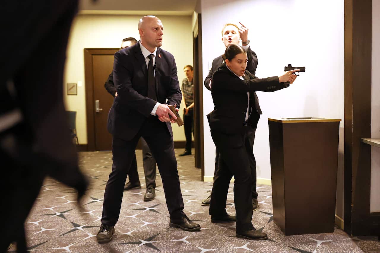Secret service agents respond during the White House Correspondents Dinner, 
