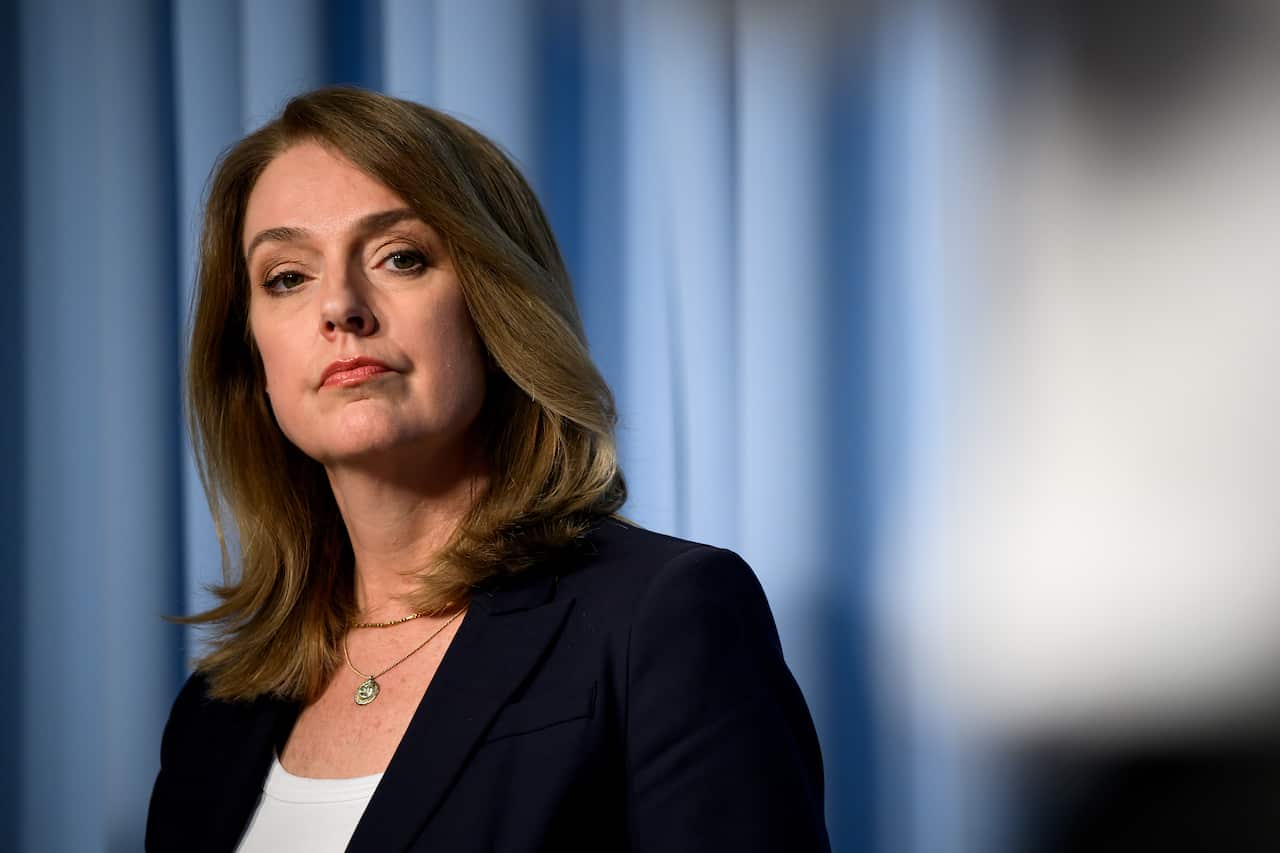 A middle-aged white woman with light brown hair