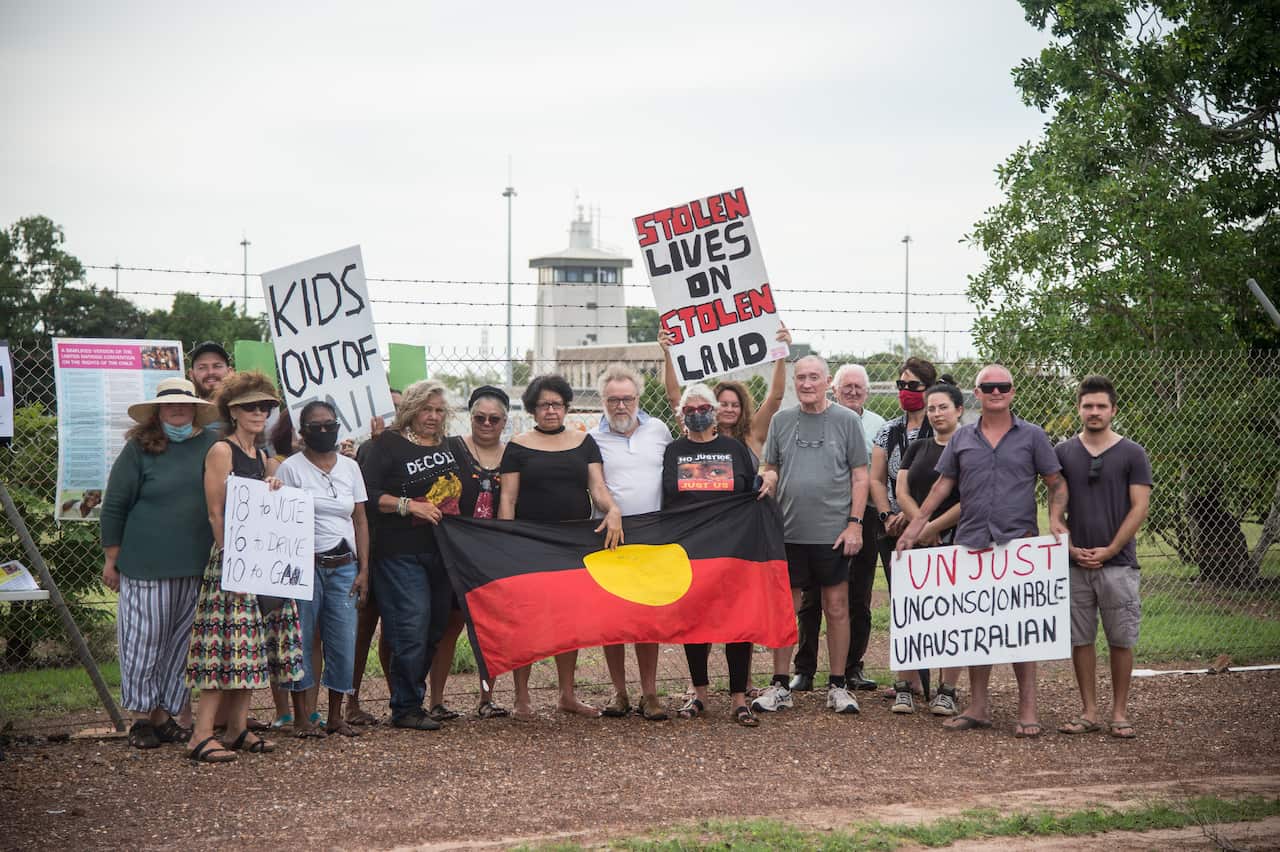 A small group of activists are seen gathered outside the Northern Territory's Don Dale youth detention centre in Darwin on 31 December, 2021.