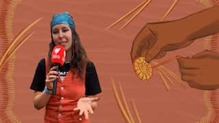 A woman wearing a blue bandana and a red jump suit is speaking into an SBS microphone. There is a sketch of hands weaving in the background.