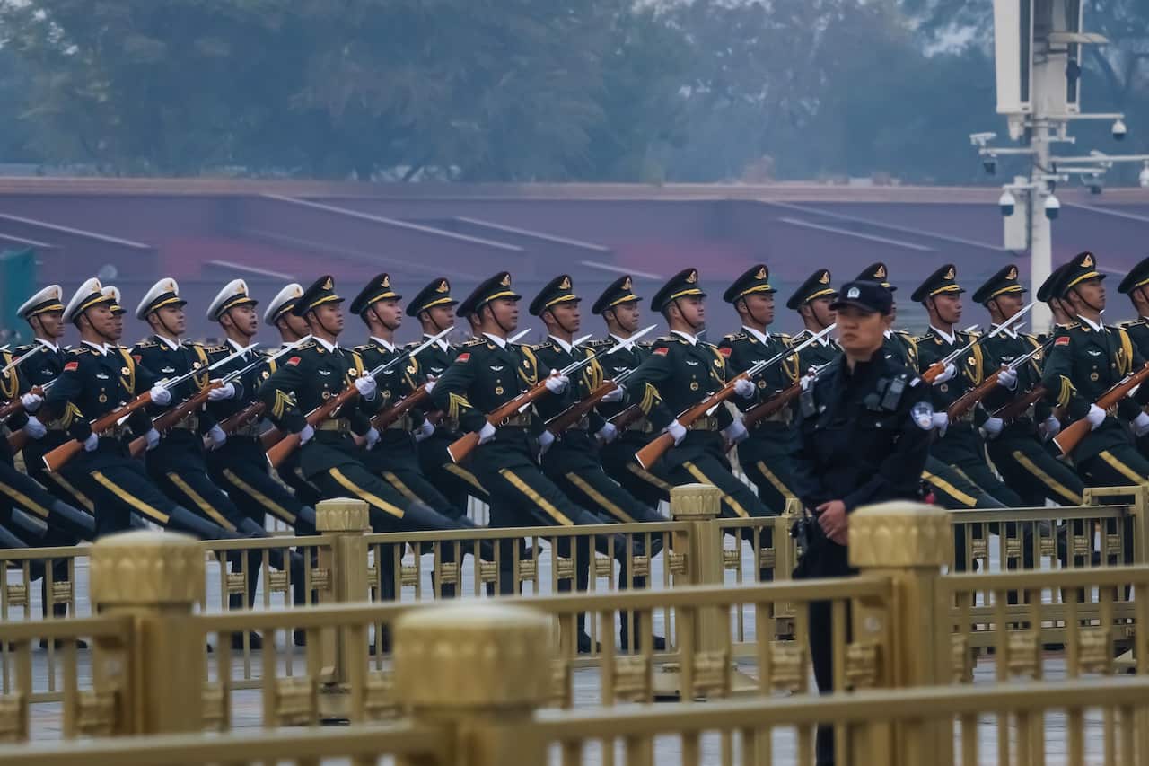 Army officers marching in a line.