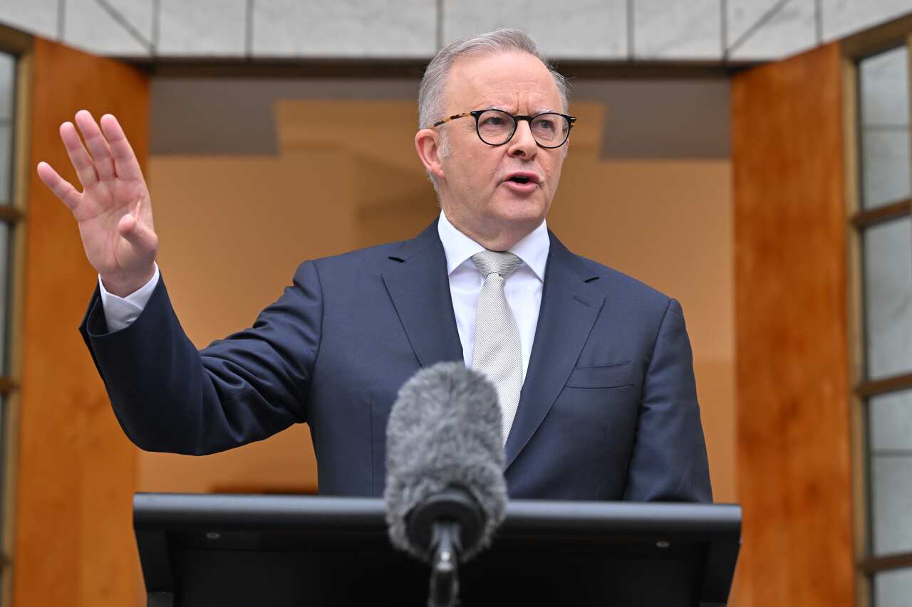Anthony Albanese gestures as he addresses the media. 
