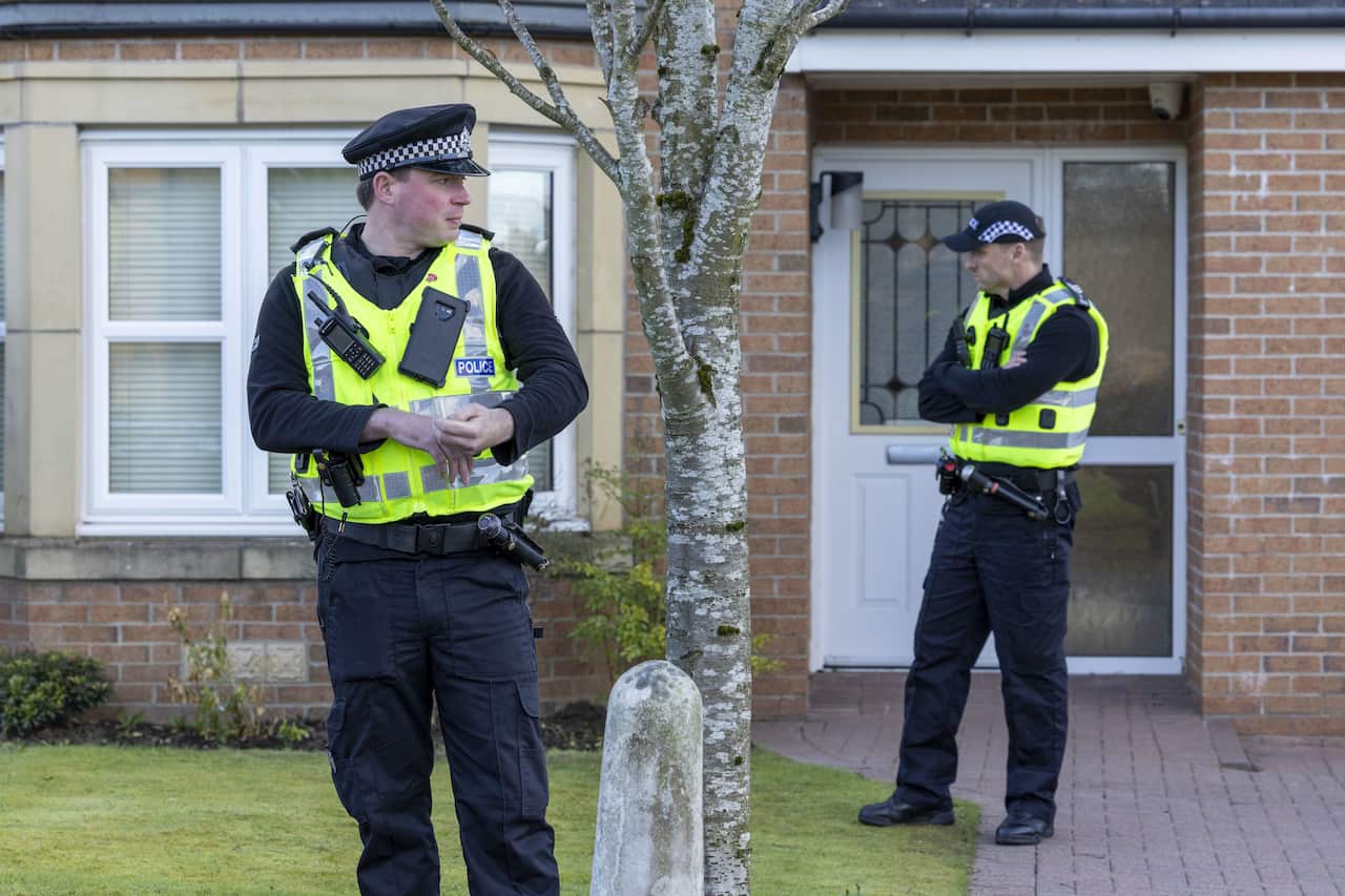 Police officers standing outside Nicola Sturgeon's home