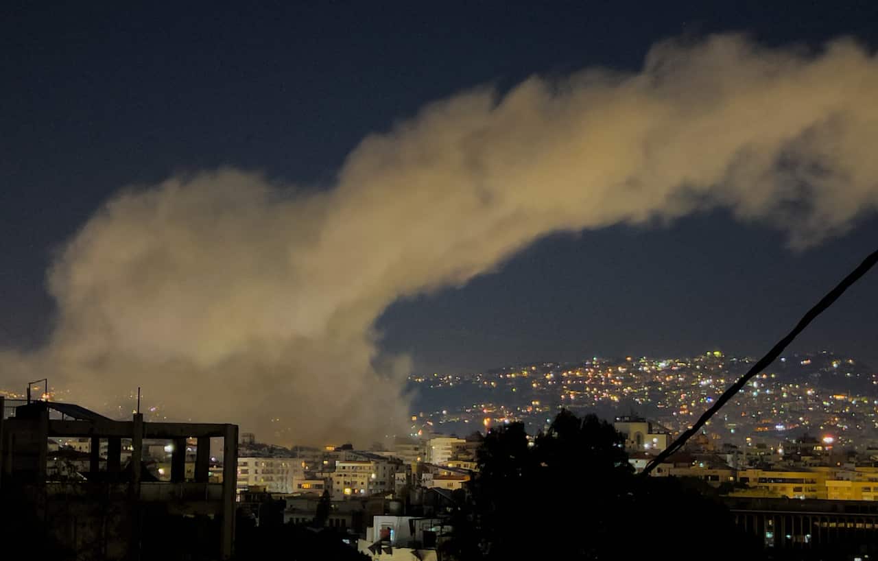 Smoke rises after airstrikes.