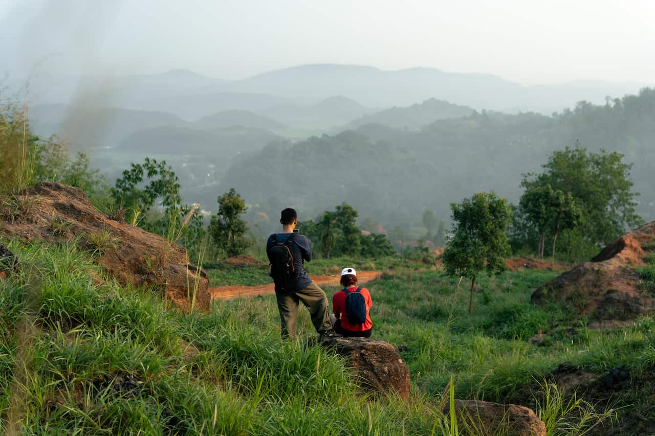 Two adult friends enjoying the scenic beauty of nature.