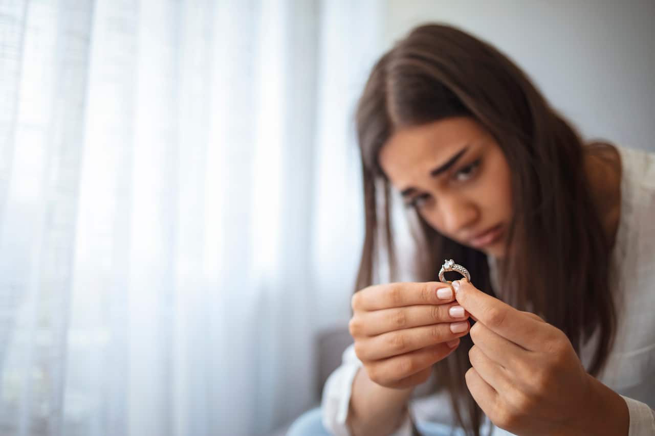 Close up of decisive woman take off wedding ring make decision breaking up with husband
