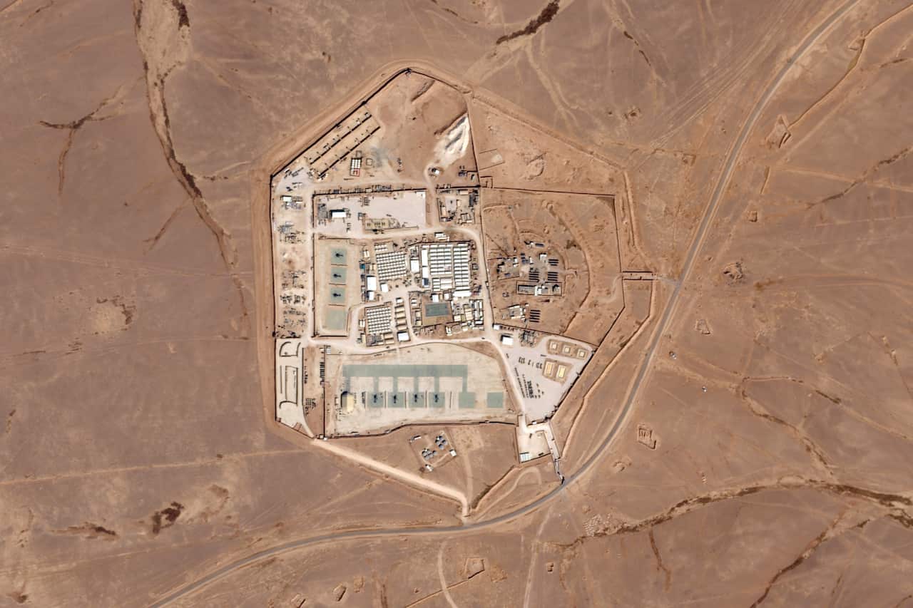 An aerial view of a military base in a desert region. 