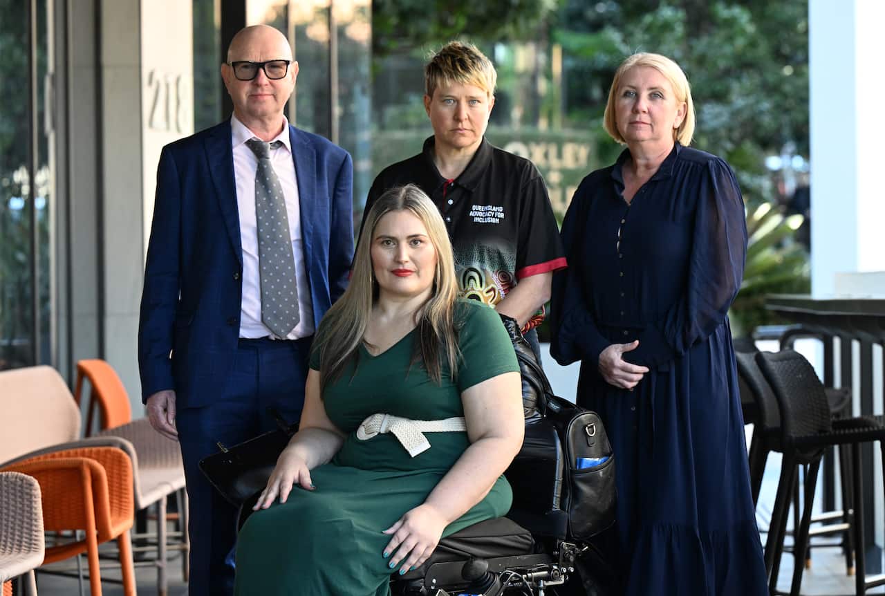 Simon Burchill, executive officer of Physical Disabilities Australia, Marayke Jonkers, Matilda Alexander, CEO of Queensland Advocacy Incorporated and Michelle Moss, CEO of Queenslanders with Disability Network together during a press conference in Brisbane.