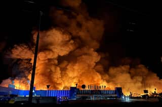 A large fire above a shopping centre.
