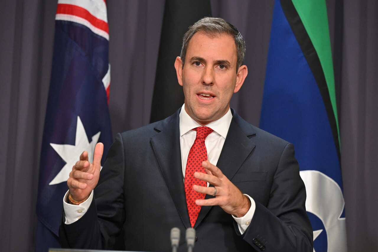 Jim Chalmers speaking at a podium