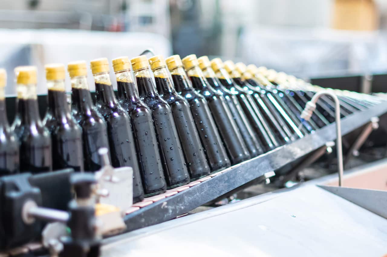 Soy sauces getting bottled on a factory lineSoy sauces getting bottled on a factory line