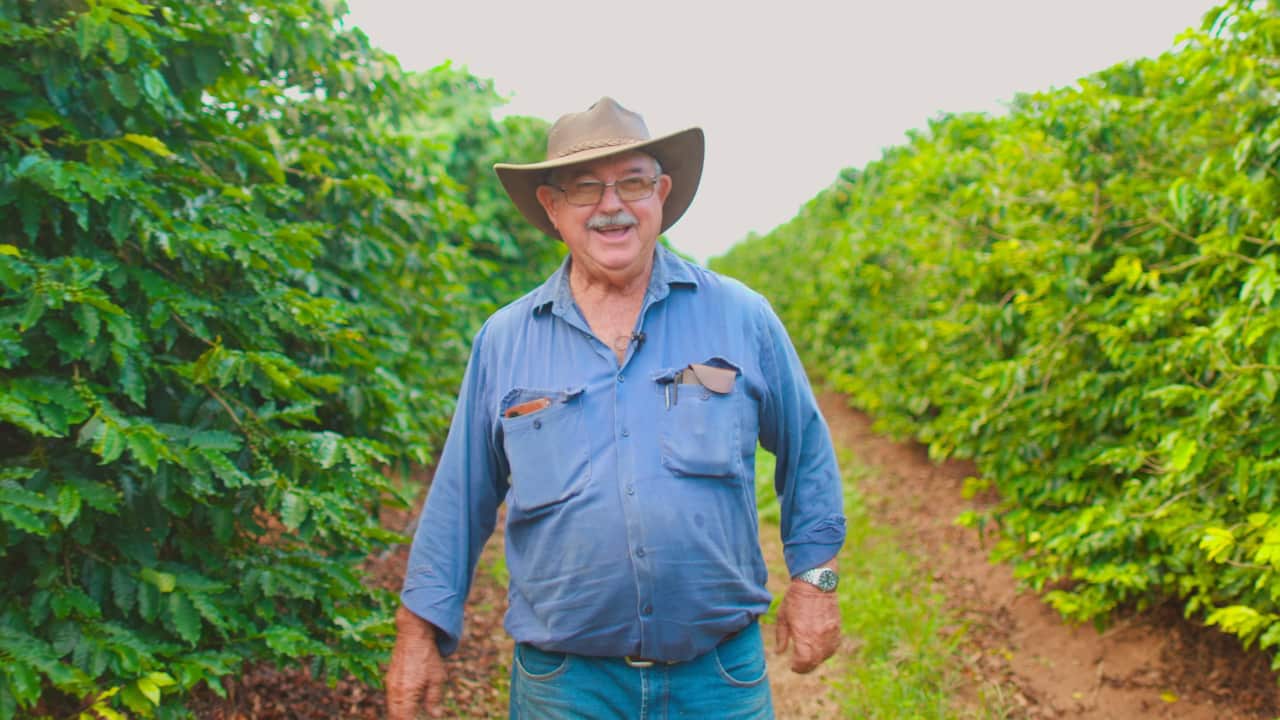 Plum Murat with brothers at his coffee farm.jpg