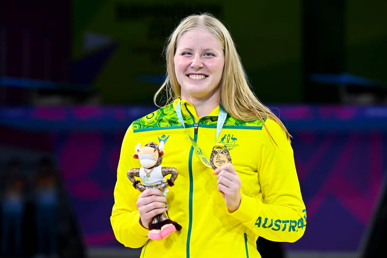 Katja Dedekind of Australia holds the gold medal she won in the Women's 50m Freestyle S13 Final on Day 2 of the Commonwealth Games. 