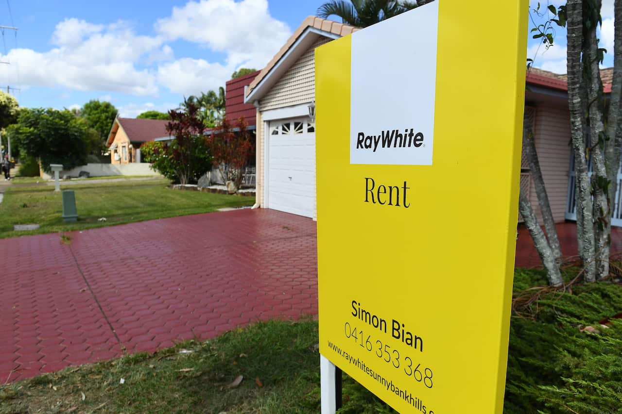 A rental sign is seen outside a house