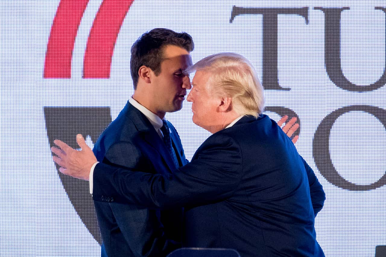 Donald Trump and Charlie Kirk embrace