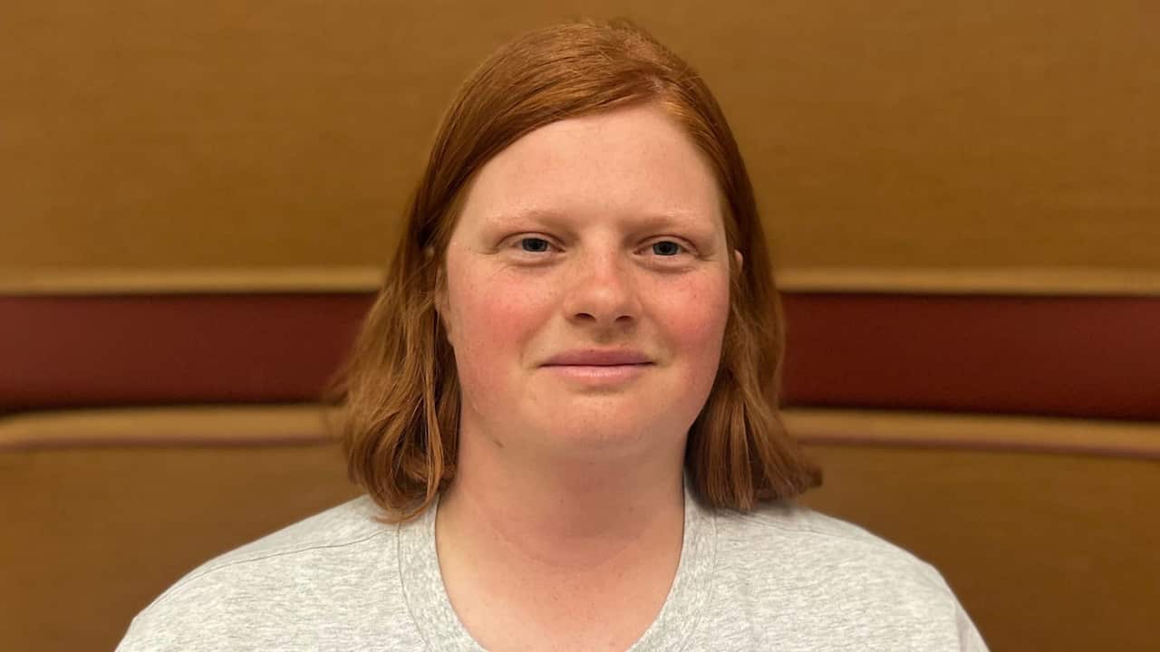 a closeup of a young redhaired woman