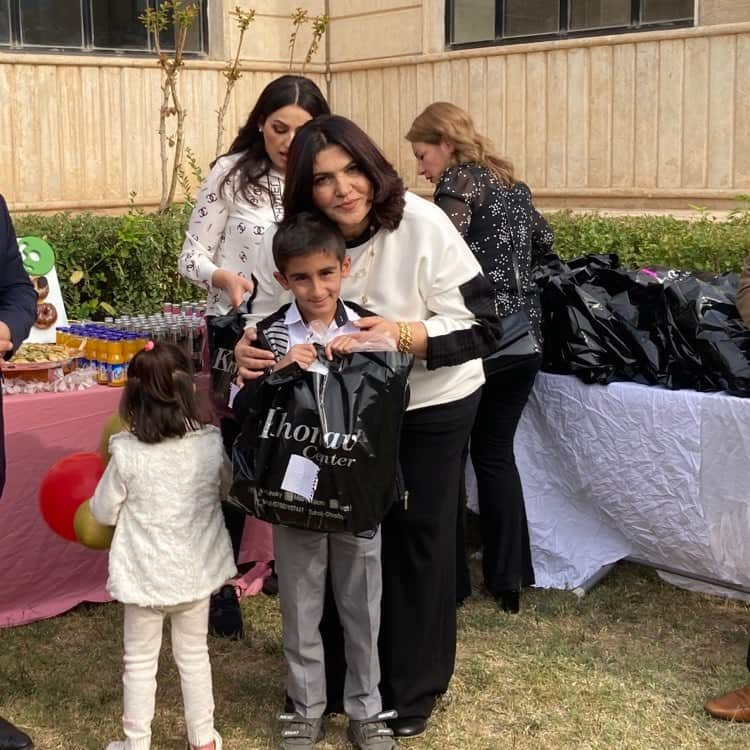 Ms Ibrahim handing a present to one of the cancer patients 