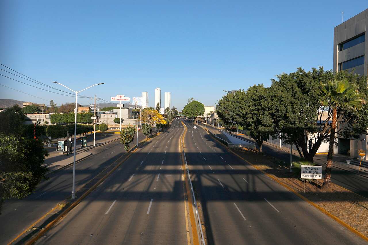 A road going through a town that is empty of people.